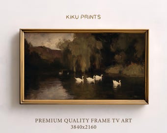 May include: A framed landscape painting featuring a serene river scene with white swans. The artwork, with the text "KIKU PRINTS" at the top, is set in a gold-colored frame. The bottom of the frame has the text "PREMIUM QUALITY FRAME TV ART 3840x2160".