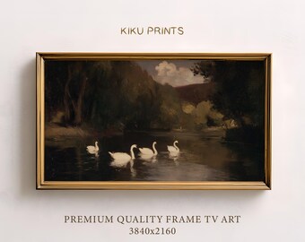 May include: Framed artwork featuring a serene river scene with four white swans gliding across the water. The painting is set in a lush, green landscape with trees and a distant bridge. The frame is gold, and the text "KIKU PRINTS" is visible.