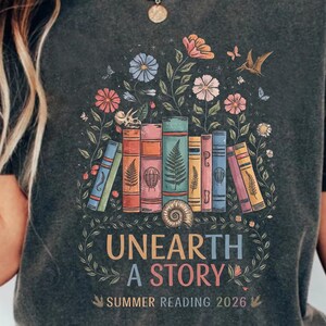 Unearth A Story Shirt, Summer Reading 2026, Fossil Book Lover Gift, Librarian Teacher Shirt, Archaeology Reader, Paleontology Science Gift image 2