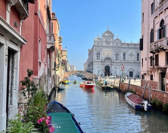 Photograph I took of one of the canals in Venice Italy. The morning sunshine hit the surrounding buildings perfectly for this image.