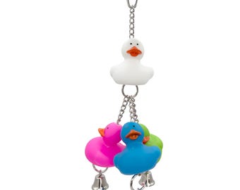 May include: A colorful bird toy with three rubber duckies hanging from a silver chain. The duckies are pink, blue, and green. The toy has a silver clip for attaching to a cage.