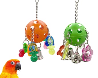 May include: Two colorful bird toys. One is orange, the other green, each with a perforated ball, hanging chains, bells, and assorted plastic shapes. The toys are designed to entertain birds.