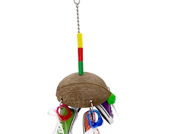 May include: A bird toy featuring a coconut shell base with colorful mini sneakers hanging from it. The sneakers are in various colors, including green, orange, and purple. A chain and a clip are attached to the top for hanging. The toy also has colorful plastic pieces.