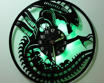 Wall clock made from old vinyl and RGB Alien LED light