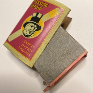 Vintage matchbox cover with vintage advertising graphic