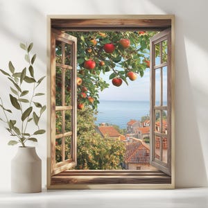May include: A framed print depicting an open window with a view of a coastal town. Red apples hang from a tree branch, overlooking the sea and buildings with red tile roofs. The window frame is made of light brown wood.