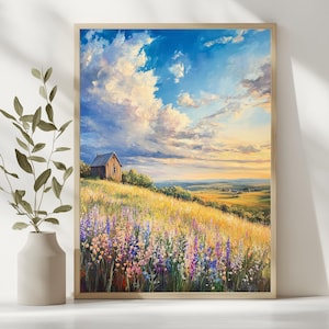 Puede incluir: Pintura de paisaje enmarcada que representa un campo de flores silvestres con una pequeña casa de madera en una colina. El cielo es una mezcla de nubes azules y blancas, con un brillo dorado del sol poniente. La pintura está en un marco de madera.
