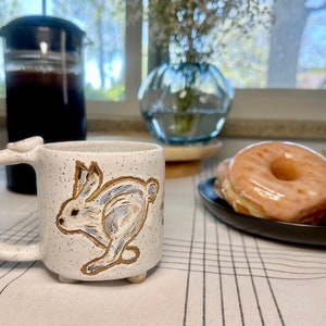 8oz Handmade Ceramic Rabbit Running Through the Snow Mug
