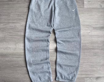 nike mini swoosh oversized sweatpants in gray