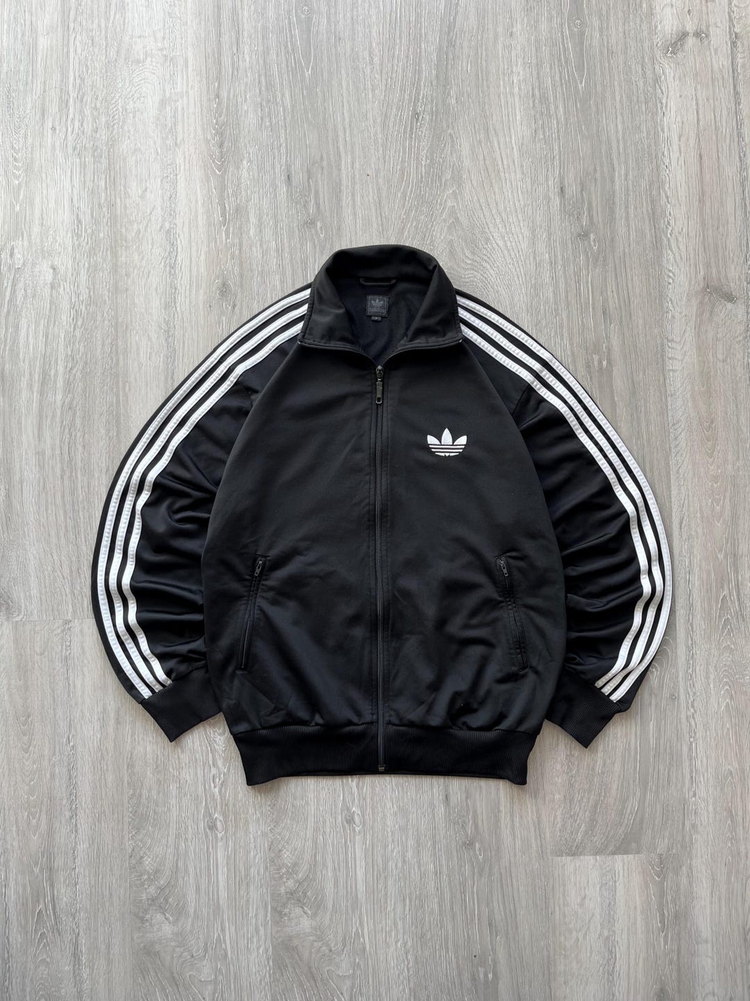 Chaqueta deportiva vintage Adidas Firebird negra y blanca