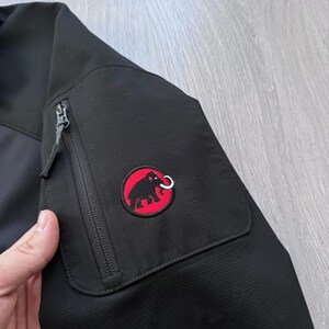 May include: A set of three ceramic mugs with a speckled, matte finish. The mugs are in shades of cream, light gray, and dark gray. Each mug has a simple, minimalist design, suitable for coffee or tea.