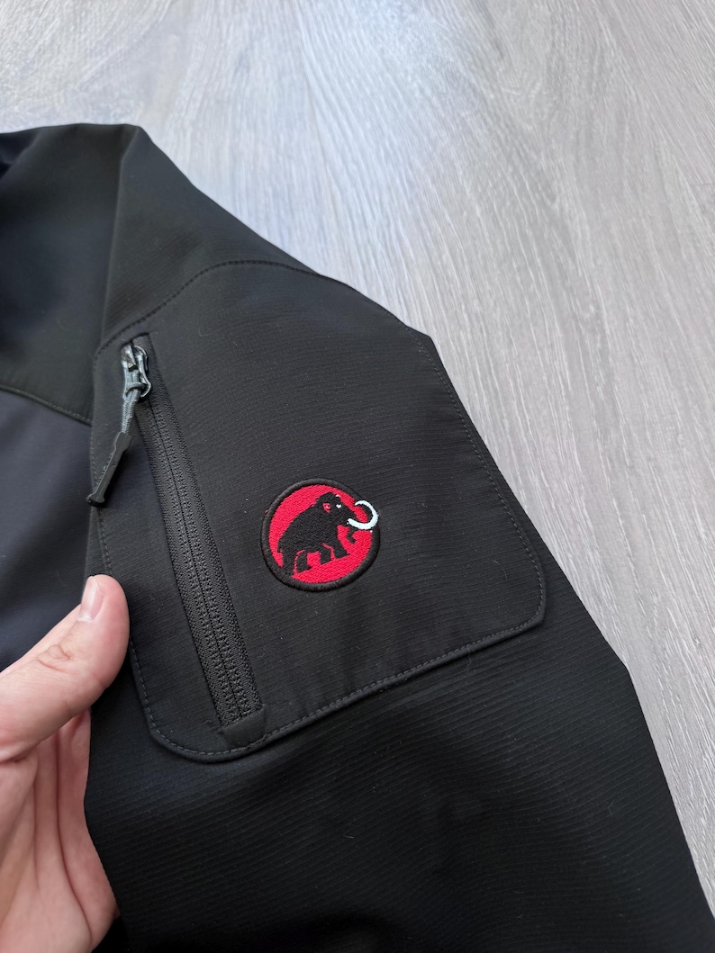 May include: A set of three ceramic mugs with a speckled, matte finish. The mugs are in shades of cream, light gray, and dark gray. Each mug has a simple, minimalist design, suitable for coffee or tea.