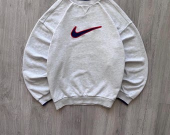 Sudadera Nike gris vintage con cuello redondo y holgada, con el logo Swoosh grande bordado en el centro, años 90