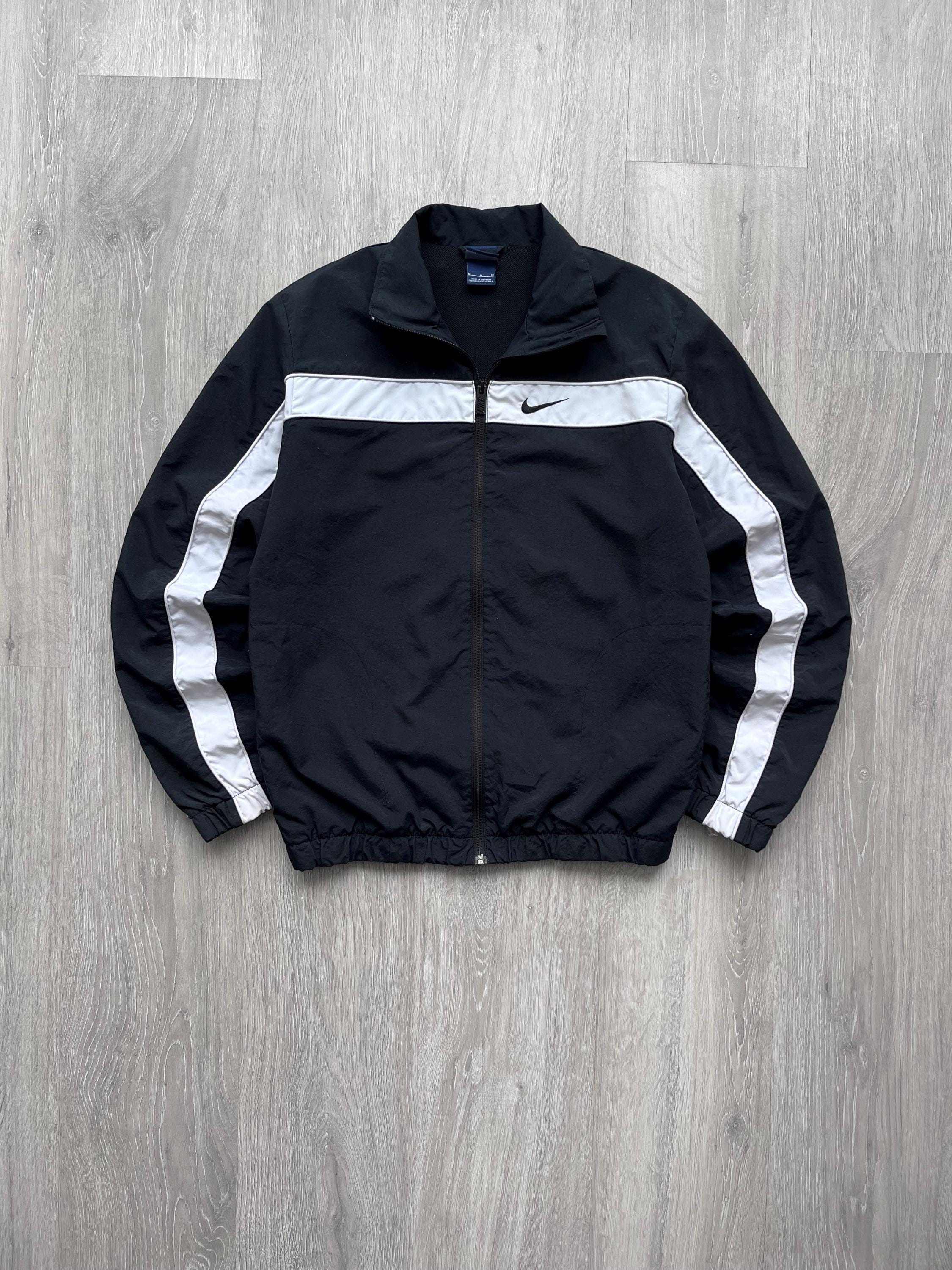 black nike windbreaker with white stripes