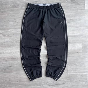 nike swoosh joggers black and white