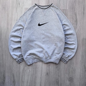 May include: A rustic wooden sign with the text "Welcome to our home" in white lettering. The sign features a distressed finish and a simple, inviting design, perfect for entryway decor.