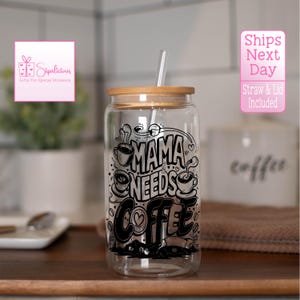 May include: A clear glass tumbler with a bamboo lid and a black and white graphic that says "Mama Needs Coffee". The tumbler comes with a straw.
