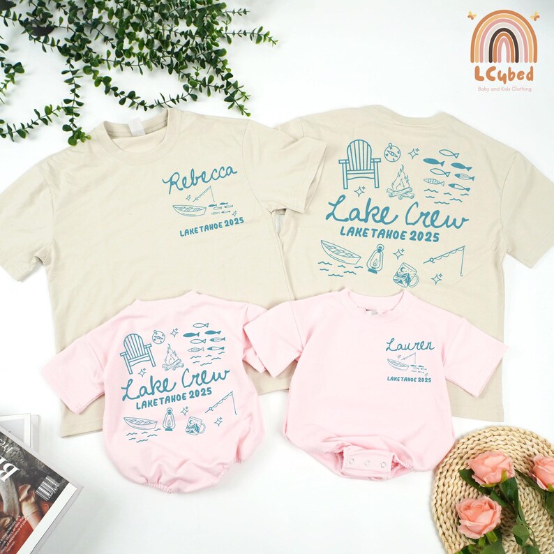 May include: Four t-shirts and baby rompers in beige and pink. The beige shirts have "Rebecca" and "Lake Tahoe 2025" printed on them, and "Lake Crew Lake Tahoe 2025" on the back. The pink rompers have "Lake Crew Lake Tahoe 2025" and "Lauren Lake Tahoe 2025" printed on them.