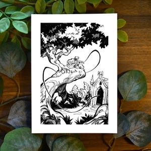 May include: A rectangular art print featuring a black and white ink illustration of a figure with long hair sitting on a large, gnarled tree branch. Below the tree, a small stone structure with a pointed roof stands near dense foliage.