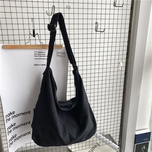 Canvas-Tasche für Damen und Herren Minimalistische Einkaufstasche Allzwecktasche Umweltfreundliche Umhängetasche Einfache Tasche Schwarz