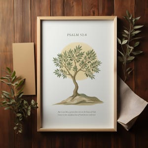 Puede incluir: Una impresión enmarcada con una ilustración de un olivo verde y el texto "PSALM 52:8" y "Pero yo soy como un olivo verde en la casa de Dios. Confío en el amor inquebrantable de Dios para siempre jamás."