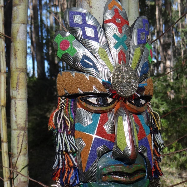 Decorative mask carved in pine wood and plated with embossed metals (bronze, copper, nickel silver) includes details and motifs from the INKA culture