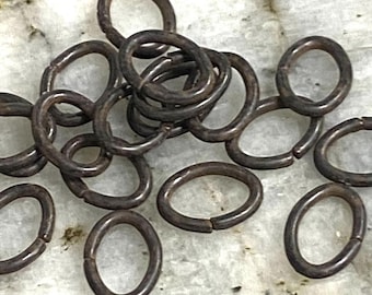 Oval rusty brown open jump ring 5 x 7 x .9mm 3 gram weight roughly 30 pieces