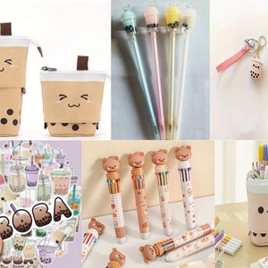 May include: Assortment of boba tea themed stationery and accessories, including a brown and white pencil case, a keychain, stickers, and pens with bear toppers. The pens have multiple colors of ink and are decorated with boba tea designs.