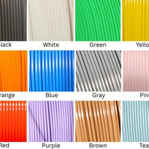 May include: A grid of twelve colored 3D printer filament spools, each labeled with its corresponding color: black, white, green, yellow, orange, blue, gray, pink, red, purple, brown, and teal. Each section shows a close-up of the coiled plastic.