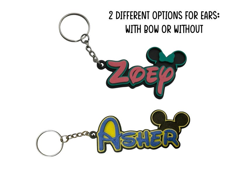 Two keychain examples shown. One girl version with a bow in teal and pink colors. The other version for a boy in yellow and dark blue colors. The girl version has a bow on the mouse head and the boy version does not.