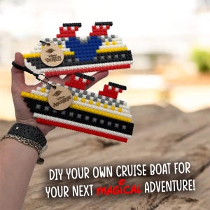 May include: Two DIY cruise boat kits made of colorful plastic blocks. One boat features a Mickey Mouse design. Each kit has a wooden tag that says "Disney Adventure" or "Disney Destiny". The text at the bottom says "DIY YOUR OWN CRUISE BOAT FOR YOUR NEXT MAGICAL ADVENTURE!"