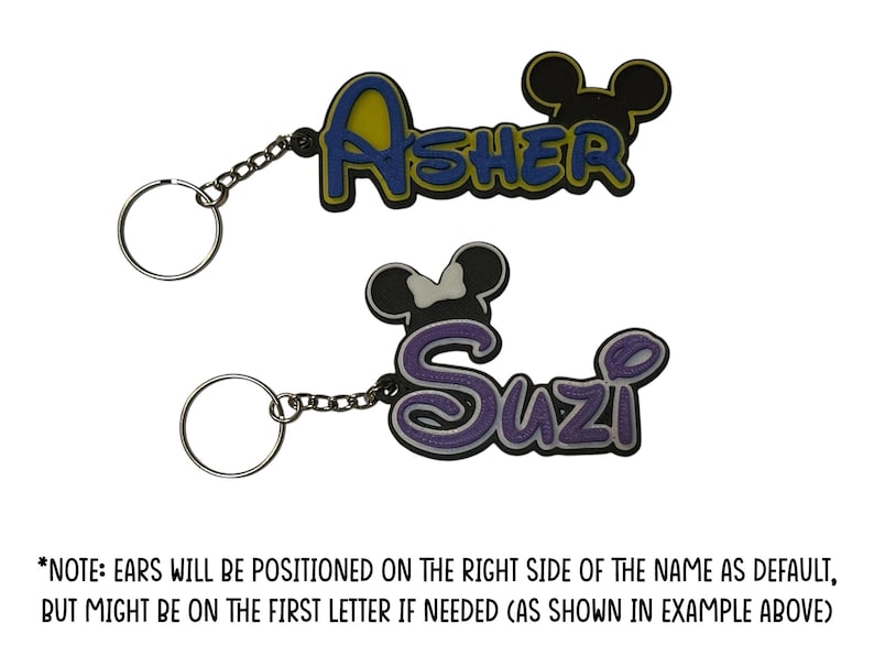 Two mouse inspired keychain examples.The boy version has the mouse head design on the right above the last letter in the name. The girl version has the mouse head with bow design on the left above the first letter of the name.