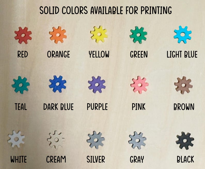 A chart showing 15 different solid colors available for printing. The colors are displayed in a grid of three rows and five columns. The colors are: red, orange, yellow, green, light blue, teal, dark blue, purple, pink, brown, white, cream, silver, gray, and black.