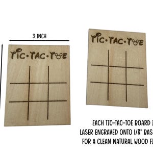 Two wooden tic-tac-toe boards with the words 'Tic-Tac-Toe' engraved on them. Each board measures 3 inches by 4 inches. The boards are laser engraved onto 1/8 inch basswood for a clean natural wood finish.