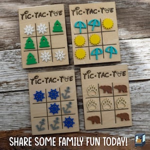 May include: Four wooden tic-tac-toe boards with various themed game pieces: snowflakes and trees, umbrellas and suns, ship wheels and anchors, and bear paws and bears. The text "SHARE SOME FAMILY FUN TODAY!" is at the bottom.