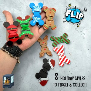 May include: Eight holiday-themed fidget toys with hinged designs, featuring various patterns including a Santa suit, elf outfit, snowflake, gingerbread man, reindeer, candy cane stripes, and a black character with a Santa hat, labelled FLIP.