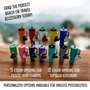 May include: A collection of colorful tumbler keychains with matching mouse head charms. The tumblers come in various colors, including orange, red, white, yellow, green, pink, black, purple, teal, and gray. The image includes the text "Grab the perfect beach or travel accessory today!"