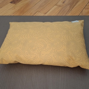 May include: A set of three ceramic mugs with a speckled, matte finish. The mugs are in shades of cream, light gray, and dark gray. Each mug has a simple, minimalist design, perfect for coffee or tea.