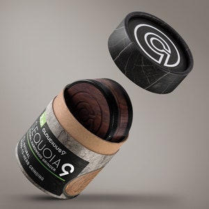 May include: A brown and black wooden grinder with the text "Cloudicous Sequoia 9 Natural Hardwood Grinder Wood-to-Herb Grinding" on the side. The grinder is in a cardboard tube with a black lid.