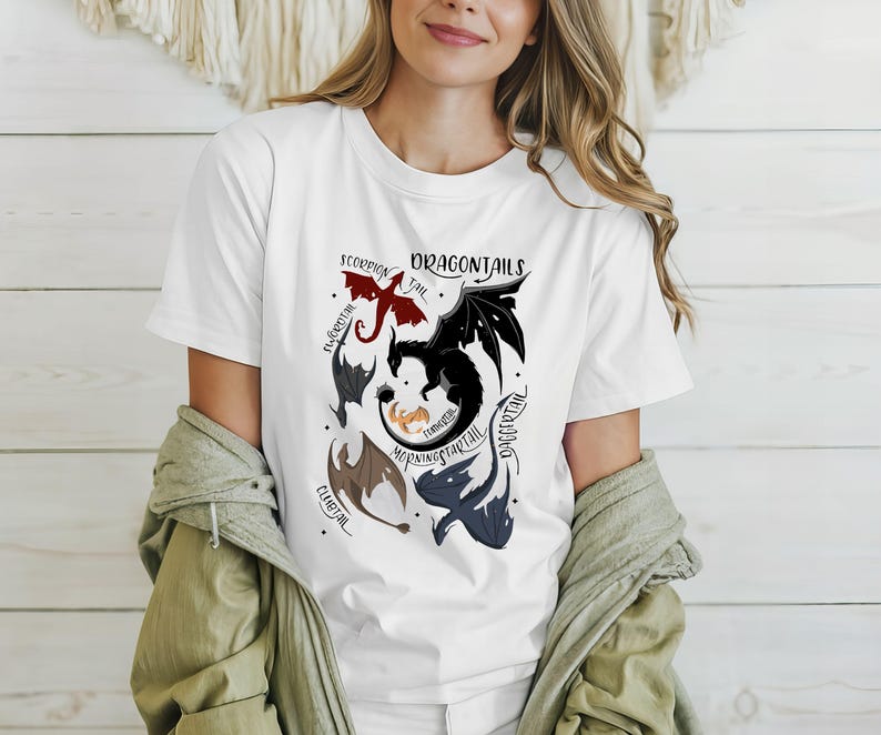 May include: White t-shirt with a graphic of different dragon tails. The tails are labeled with names like "Scorpion Tail", "Morningstar Tail", and "Daggertail".