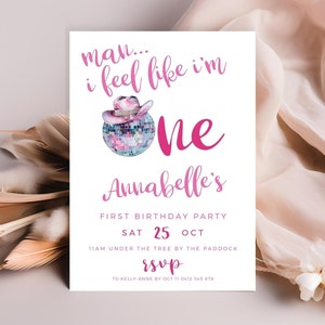 May include: Pink and white birthday party invitation with a disco ball and a pink cowboy hat. The text reads "man... i feel like i'm one Annabelle's First Birthday Party Sat 25 Oct 11am under the tree by the paddock rsvp to Kelly Anne by Oct 11 0412 345 678"