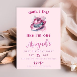 May include: Pink and white birthday party invitation with a pink cowboy hat illustration and the text "man, I feel like I'm one Abigail's First Birthday Party Sat 25 Oct 11am under the tree by the paddock RSVP to Kelly Anne by Oct 11 0412 345 678"