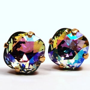 May include: A pair of iridescent gold-tone earrings with square-shaped crystals.