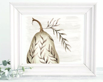 May include: A framed watercolour print of a pear-shaped gourd with brown leaf accents. The gourd is a soft green colour, and the frame is white. The artwork has a neutral background and is a decorative piece.