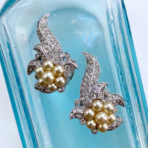 Lot - Trifari Empress Eugenie dangle pin clip and earrings with gold wash,  navy enamel, rhinestones, and faux pearls.