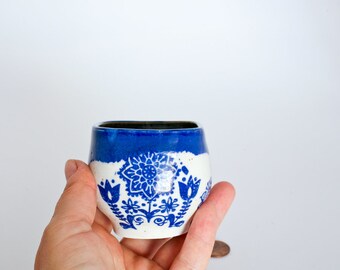 Blue birds ethnic patterned ceramic wine cup tumbler handmade on the wheel out of a ball of clay and glossy blue glazes