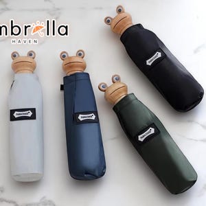 Ombrello pieghevole con manico a forma di rana / Ombrellone con supporto in simil-legno / Copertura leggera per tutti i giorni / Divertente accessorio da viaggio / Attrezzatura compatta per esterni