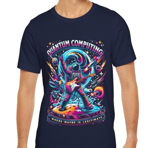 May include: A navy blue t-shirt with a graphic of an astronaut playing a guitar in space. The text "Quantum Computing" is above the astronaut and "Where 'Maybe' is Legitimate" is below the astronaut.