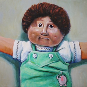 May include: A painting of a doll with brown hair, wearing a white shirt and green overalls with a pink elephant patch. The doll has a freckled face and large, dark eyes.