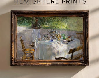 May include: A framed painting of a table setting with a silver teapot, plates, and glasses. A woman in a white dress stands behind the table, holding a tray. The scene is set in a garden with trees and sunlight.